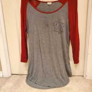 A long sleeved shirt from Garage, size M (Canada) in medium green and deep red.